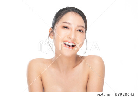 Beautiful Asian woman looking at camera smile with clean and fresh skin Happiness and cheerful with positive emotional,isolated on white background. Beauty and Cosmetics Concept. Proud her self. 98928043