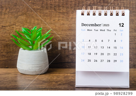 The December 2023 Monthly desk calendar for 2023 year with plant pot. The December 2023 Monthly desk calendar for 2023 year with plant pot. 98928299