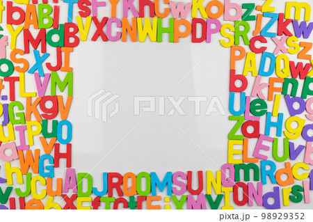 Colorful alphabet magnets on whiteboard framing copy space Colorful alphabet magnets on whiteboard framing copy space 98929352