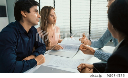 Commercial, agreement deal signed by competent people of several ethnicities. 98934526