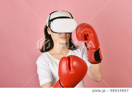 Asian woman using vr glasses, Working out with boxing video games application from virtual reality 98934897