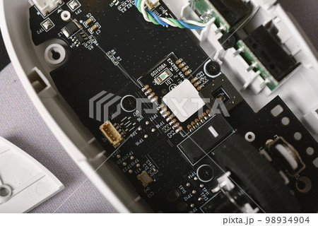 Separated parts of broken mouse, Disassembled computer mouse for repair and fixing. Separated parts of broken mouse, Disassembled computer mouse for repair and fixing. 98934904