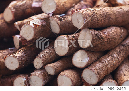Stack of cassavas on a market stall Stack of cassavas on a market stall 98940866
