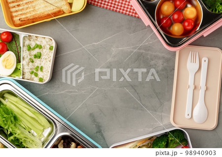 Containers with healthy food on gray background top view. Containers with healthy food on gray background top view. 98940903
