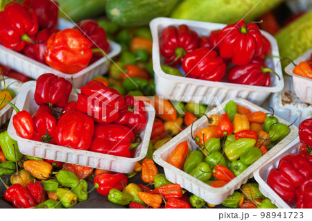 Stack of Piment cabri on a market stall Stack of Piment cabri on a market stall 98941723