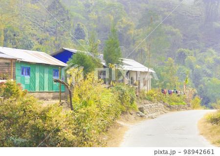 A beautiful wooden hill side cottage on mountain background.Rangbang river mountain valley.Tabakoshi West Bengal IndiaDecember 31, 2022 A beautiful wooden hill side cottage on mountain background.Rangbang river mountain valley.Tabakoshi West Bengal IndiaDecember 31, 2022 98942661
