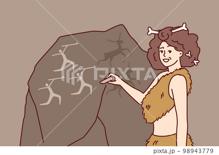 Ancient woman in clothing from animal skins and bones in hair makes rock paintings 98943779