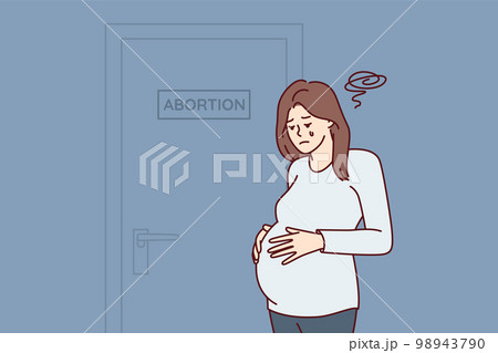 Upset pregnant woman near door with abortion sign after making difficult decision Upset pregnant woman near door with abortion sign after making difficult decision 98943790