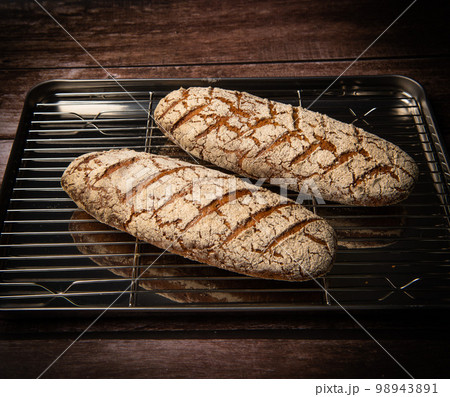 Rye bread on brown background Rye bread on brown background 98943891