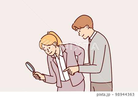 Man and woman working as detectives use magnifying glass during investigation to find evidence Man and woman working as detectives use magnifying glass during investigation to find evidence 98944363