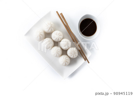Steamed dumplings isolated on white background. Traditional oriental food. Steamed dumplings isolated on white background. Traditional oriental food. 98945119