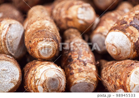 Stack of taro on a market stall 98945533
