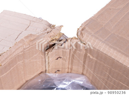 Battered cartboard box isolated on white Battered cartboard box isolated on white 98950236