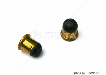 Two .22 BB caps on white background 98950595
