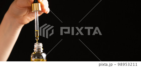 Natural oil for the care of eyelashes, eyebrows, facial skin drips into a glass jar of pipette 98953211