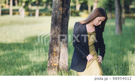 The girl is upset about her torn dress. The girl is upset about her torn dress. 98954012