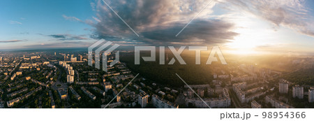 Wide aerial sunrise cloudscape panorama above city Wide aerial sunrise cloudscape panorama above city 98954366