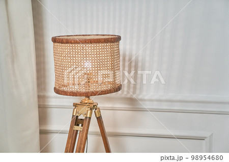 Decorative floor lamp, corner lamp, ideal for reading in the living room or at the desk. It is used to decorate the corners of rooms. Lamp with copy space. High quality photo 98954680