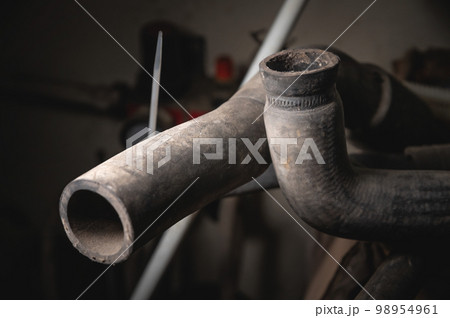 Old engine cooling hoses. Branch pipes worn in selective focus 98954961