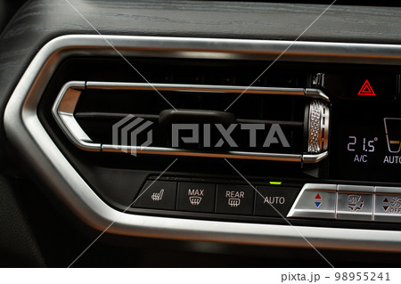 Windshield defrost button. Modern car interior details. Windshield heating close up view. Windshield defrost button. Modern car interior details. Windshield heating close up view. 98955241