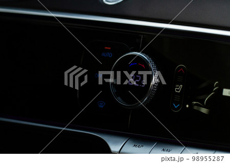 Digital control panel car air conditioner dashboard. Modern car interior conditioning buttons inside a car close up view. Digital control panel car air conditioner dashboard. Modern car interior conditioning buttons inside a car close up view. 98955287