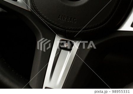 Heated steering wheel switch. Steering wheel heating control panel close up view. 98955331