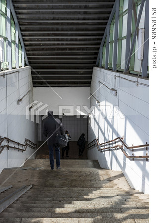 Descent to the pedestrian underpass on the city street. Descent to the pedestrian underpass on the city street. 98958158