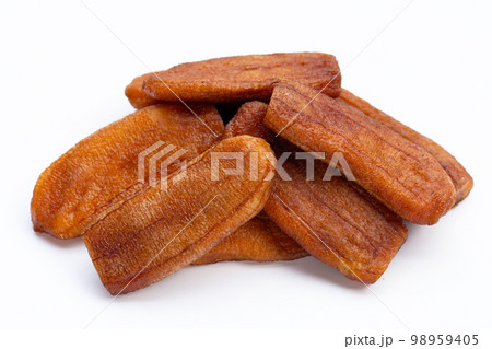 Sun dried bananas on white background. Sun dried bananas on white background. 98959405