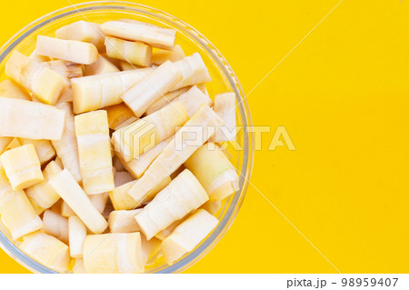 Bamboo shoots on yellow background. Bamboo shoots on yellow background. 98959407