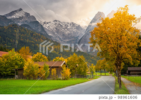 Bavarian alps and rustic farm barn, Garmisch, Zugspitze massif, Bavaria, Germany Bavarian alps and rustic farm barn, Garmisch, Zugspitze massif, Bavaria, Germany 98961606
