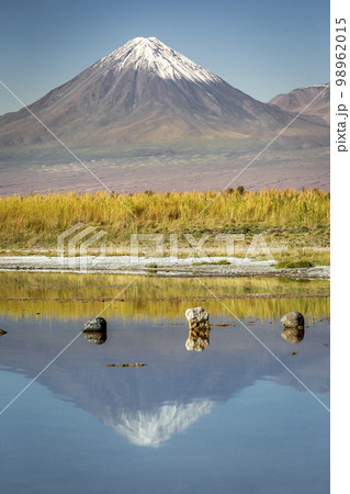 Licancabur with reflection lake and volcanic landscape at Sunset, Atacama, Chile Licancabur with reflection lake and volcanic landscape at Sunset, Atacama, Chile 98962015