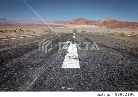 Road in Moon Valley dramatic landscape at Sunset, Atacama Desert, Chile Road in Moon Valley dramatic landscape at Sunset, Atacama Desert, Chile 98962190