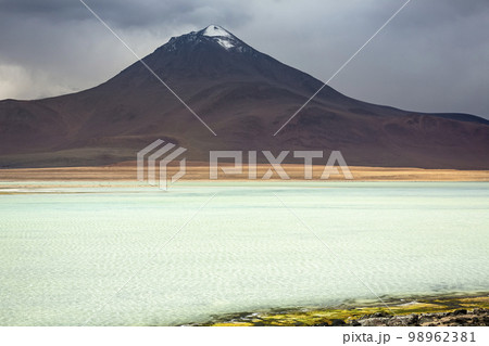 Salt lake, volcanic landscape at Sunset, Atacama, Chile border with Bolivia 98962381