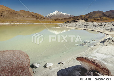 Salt lake in Piedras Rojas, volcanic landscape at sunrise, Atacama, Chile Salt lake in Piedras Rojas, volcanic landscape at sunrise, Atacama, Chile 98962394