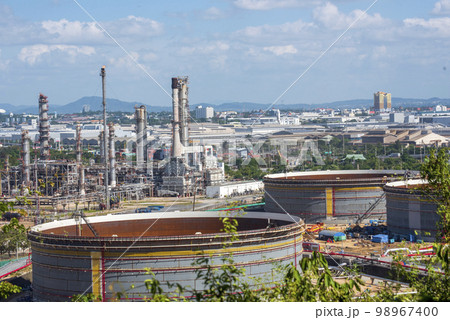 Oil refinery gas petrol plant industry with crude tank, gasoline supply and chemical factory. Petroleum barrel fuel heavy industry oil refinery manufacturing factory plant. Refinery industry concept Oil refinery gas petrol plant industry with crude tank, gasoline supply and chemical factory. Petroleum barrel fuel heavy industry oil refinery manufacturing factory plant. Refinery industry concept 98967400