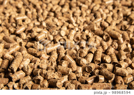 Toilets for pets, wood filler in the form of small compressed pellets background 98968594
