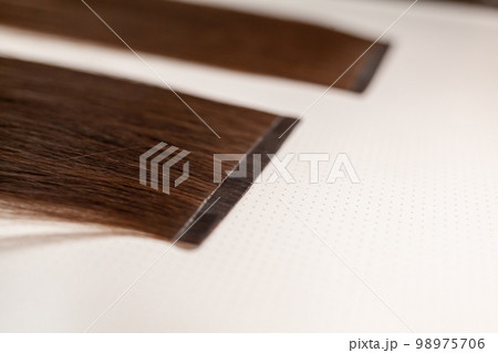The process of preparing a hair ribbon for extension at home. The process of preparing a hair ribbon for extension at home. 98975706