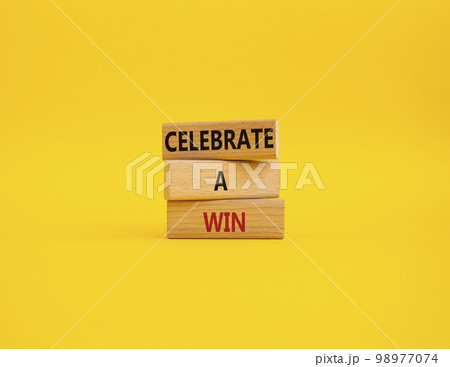 Celebrate a win symbol. Concept words Celebrate a win on wooden blocks. Beautiful yellow background. Business and Celebrate a win concept. Copy space. Celebrate a win symbol. Concept words Celebrate a win on wooden blocks. Beautiful yellow background. Business and Celebrate a win concept. Copy space. 98977074