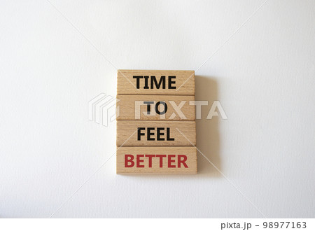 Time to feel better symbol. Wooden blocks with words Time to feel better. Beautiful white background. Medicine and Time to feel better concept. Copy space. 98977163