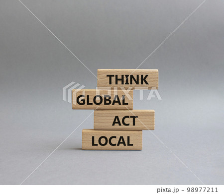 Think global act local symbol. Wooden blocks with words Think global act local. Beautiful grey background. Business and Think global act local concept. Copy space. 98977211