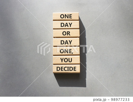 Motivation symbol. Wooden blocks with words One day or Day one you decide. Beautiful grey background. Business and motivation concept. Copy space. 98977233