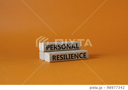 Personal resilience symbol. Wooden blocks with words Personal resilience. Beautiful orange background. Business and Personal resilience concept. Copy space. 98977342