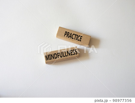 Practice Mindfullness symbol. Concept words Practice Mindfullness on wooden blocks. Beautiful white background. Medical and Psychology and Practice Mindfullness concept. Copy space. 98977356