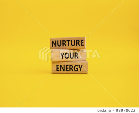 Nurture your Energy symbol. Concept words Nurture your Energy on wooden blocks. Beautiful yellow background. Business and Nurture your Energy concept. Copy space Nurture your Energy symbol. Concept words Nurture your Energy on wooden blocks. Beautiful yellow background. Business and Nurture your Energy concept. Copy space 98978622