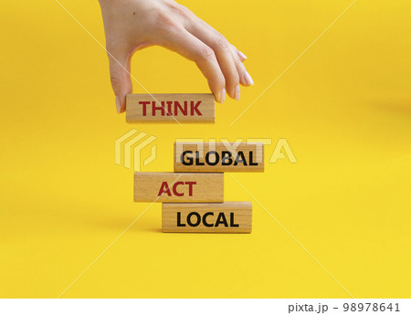 Think global act local symbol. Wooden blocks with words Think global act local. Beautiful yellow background. Businessman hand. Business and Think global act local concept. Copy space. Think global act local symbol. Wooden blocks with words Think global act local. Beautiful yellow background. Businessman hand. Business and Think global act local concept. Copy space. 98978641