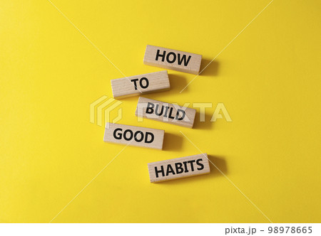 How to build good credit symbol. Concept words How to build good credit on wooden blocks. Beautiful yellow background. Business and How to build good credit concept. Copy space. 98978665