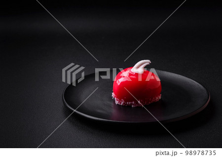Beautiful tasty cake red color cheesecake in the shape of a heart Beautiful tasty cake red color cheesecake in the shape of a heart 98978735