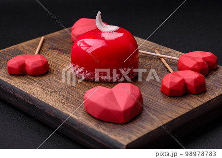 Beautiful tasty cake red color cheesecake in the shape of a heart 98978783