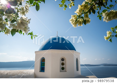 Famous blue dome of an orthodox church in Oia town Famous blue dome of an orthodox church in Oia town 98979538