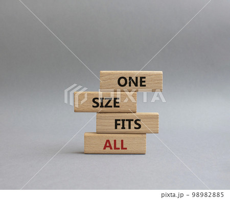 One size fits all symbol. Concept words One size fits all on wooden blocks. Beautiful grey background. Business and One size fits all concept. Copy space. 98982885